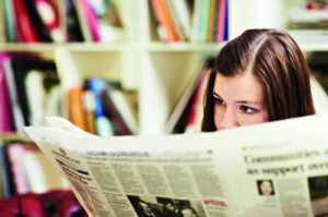 Lady reading newspaper