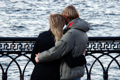 Hugging couple on a windy day