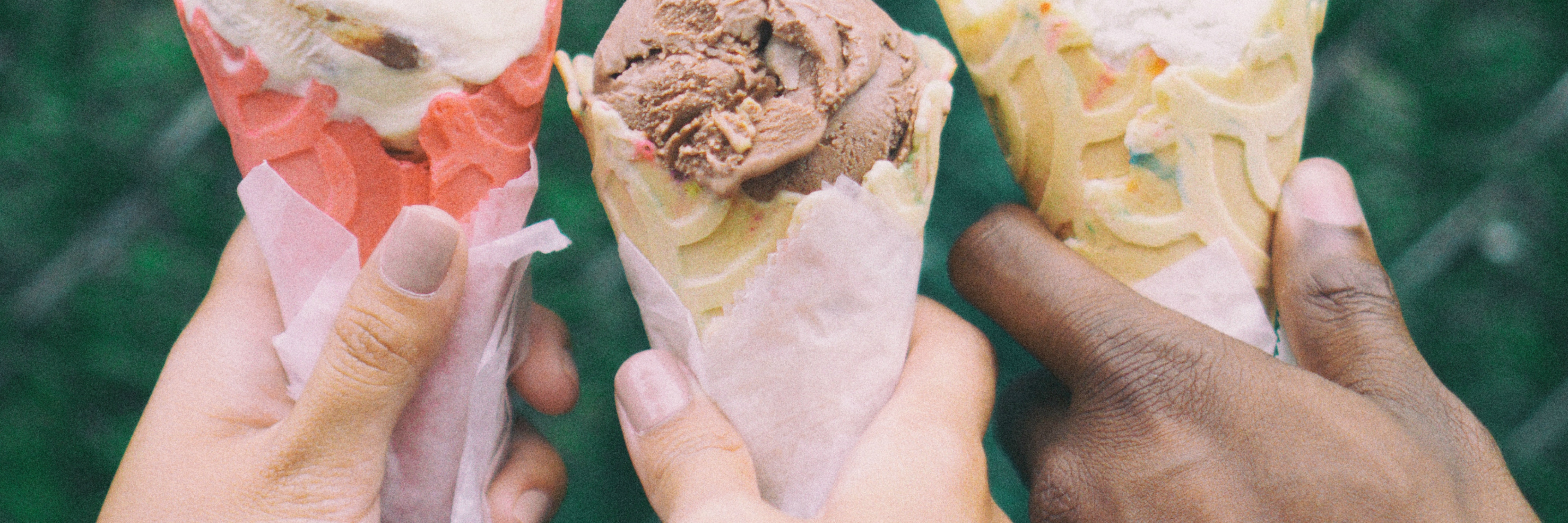 three friends sharing ice cream
