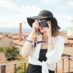 lady taking photograph on holiday