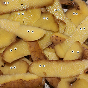 potato peelings with cartoon eyes on each piece