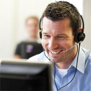 Man in call centre at computer