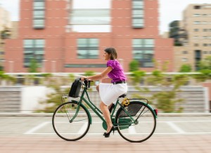 Woman on bike in city