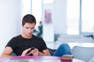 Young man looking at mobile phone